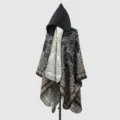 Detailed view of a hooded cloak cape featuring ethnic paisley patterns in black and beige - Black / 135*150CM