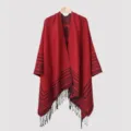 Detailed view of dark red knitted men's poncho featuring horizontal stripes and black tassels - 135*150CM / Red