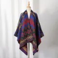 Detailed view of a warm knit geometric pattern poncho displayed on a mannequin stand - Cyan