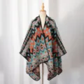 Detailed front view of a men's warm knitted poncho with geometric pattern on a mannequin. - Green Orange