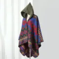 Detail view of women's hooded knitted poncho with colorful geometric pattern - One Size / Colorful Geometric Poncho in Blue-Green