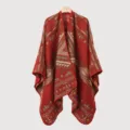 Detailed view of the ethnic geometric pattern on this warm knit poncho cape shawl. - Tribal Code Split Scarf (Rust Red)