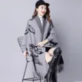 Women's knit poncho shawl with sleeves and elegant black floral pattern in soft gray - Tops / Gray