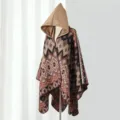 Detailed close-up view of women's hooded knit poncho with vintage geometric weave patterns. - One Size / Colorful Geometric Poncho in Camel