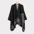Detailed view of men's knitted poncho with intricate ethnic patterns in black - Black Feather Pattern Split Scarf