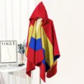 Cozy hooded knit poncho featuring vibrant red yellow and blue color blocking detail - Red