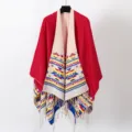 Bohemian red knit shawl poncho with ethnic geometric patterns and stylish fringe detail - Red