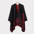 Detail of a men's knitted poncho with red floral patterns on a black background - Split Scarf in Black and Red Feather Pattern