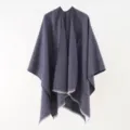 Detailed view of textured knit shawl poncho with fringed edges in navy blue - 130*160cm / Navy Blue