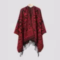 Detailed view of red and black ethnic pattern knitted poncho shawl with stylish fringe tassels - Black and Red Split Scarf