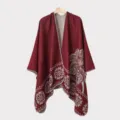 Detail of burgundy men's winter knitted poncho with ethnic white floral pattern texture - Wine Red Feather Pattern Split Scarf