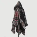 Detailed view of women's hooded knit poncho with tribal ethnic geometric patterns - Cloak Tribe Code - Black