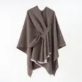 Detailed close-up of a brown knitted poncho with a stylish diagonal tie-up design - 130*160cm / Coffee