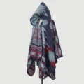Close-up detail of women's hooded knitted poncho with vintage ethnic geometric pattern - Cloak Tribe Code - Dark Blue