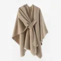 Detailed shot of a brown knit poncho featuring a unique front diagonal knot design - 130*160cm / Khaki
