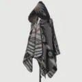 Close-up detail of the intricate ethnic geometric pattern on this hooded knit poncho cloak - Tribal Cipher Poncho - Grey