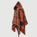 Close-up view of geometric ethnic pattern on orange hooded knit poncho shawl garment - Tribal Cipher Poncho - Orange