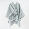 Close-up of a minimalist light grey knitted shawl with wrap-around tie and fringed edges - 130*160cm / Light Gray