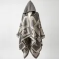 Detailed view of the hooded poncho featuring a stylish tribal geometric pattern - One Size / Gray