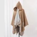 Detail of a brown knitted hooded poncho with grey butterfly floral jacquard pattern - Robe / Camel
