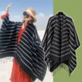 Ethnic style black and white striped knitted poncho with fringe detail, cozy winter shawl - One Size / Linear Black
