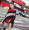 Chic striped knit poncho with tassel fringe and irregular hem, red and black style. - Tops / One Size / Red