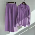 Close-up detail of the purple cotton linen long-sleeve shirt and wide leg trousers set. - S / Top And Bottom / Orange Red