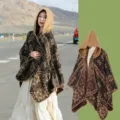 Vintage hooded ethnic style poncho cape with geometric pattern for winter travel photography. - Camel