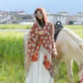 Stylish hooded travel poncho for women with orange floral knit pattern - Ice Pop-Orange