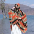 Bohemian style colorful striped hooded poncho shawl for travel and outdoor sun protection - Windy Stripes Orange