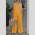 Detail view of women's sleeveless solid cotton linen top and wide leg pants set in bright yellow. - S / Top And Bottom / Yellow
