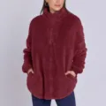 Close-up view of the plush fleece texture, quarter-zip collar, and side pocket detail. - S / Dark Red