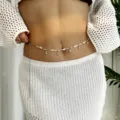 Bohemian summer style waist chain featuring white beads, real shells and silver starfish charms - 1 Piece / Shell & Conch