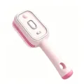 Cepillo de masaje capilar eléctrico rosa con cerdas de silicona suave y función de niebla diaria. - Rosa