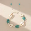 Close-up of Bohemian shell bracelet with turquoise turtle beads for beach vacations. - Off-white Braided Rope with Teal Turtle Shell (BR23Y0414-5)