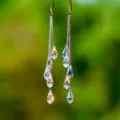 Elegant long tassel earrings featuring iridescent teardrop crystals and silver chains. - Silver Teardrop Crystal Tassel (ER23Y0221)