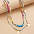 Bohemian 3-piece layered beaded necklace set with colorful beads and gold disc pendants. - Colorful Seed Bead Necklaces / New 3-Piece Set