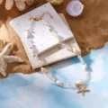 Bohemian beach necklace with crushed stones, seashells, and golden starfish charm - Necklace / Clear