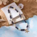 Bohemian summer beach necklace with blue crushed stones, shells and gold starfish - Necklace / Dark Blue