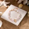 Bohemian summer beach bracelet with pink gravel, sea shells and gold starfish charm. - Bracelet / Pink