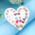 Collection of 12 pairs assorted fashion stud earrings on white heart-shaped display card - Strawberry Butterfly Set (ER24Y0074—5)