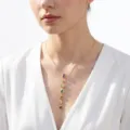 Elegant gold necklace with vertical multi-colored crystal pendant on a woman - Sparkling Multicolor Tassel Steel Style (NC24Y0289)