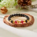 Traditional 2025 Year of the Snake black beaded bracelet with gold snake charm and red beads - Black With Red Bead