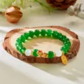 Year of the Snake beaded bracelet with green gems and golden snake charm - Emerald Green With White Bead