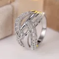 Close-up detail of a silver-colored hollow woven crisscross ring with sparkling stones - Size 6 / Hollow Woven Criss Cross Style (RR018) / Silver