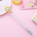 Cute creative gel pen featuring a gold flower top and crystal bead on a pastel pink background - 0.5mm / Blue