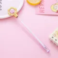 Pink candy-colored gel pen with a gold flower and purple crystal bead detail - 0.5mm / Purple