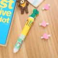 Stylo à bille rétractable créatif à 10 couleurs avec motif de dinosaure de dessin animé - Dinosaure - Jaune / Multicolore