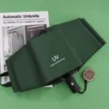 Dunkelgrüner, faltbarer automatischer UV-Regenschirm für Sonne und Regen, winddichtes Design. - Automatik-Regenschirm mit UV-Schutz - Dunkelgrün