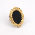 Detail view of vintage gold ornate resin jewelry frame with black velvet ring grooves - Oval Ring Velvet Style / 12 x 10cm / Black